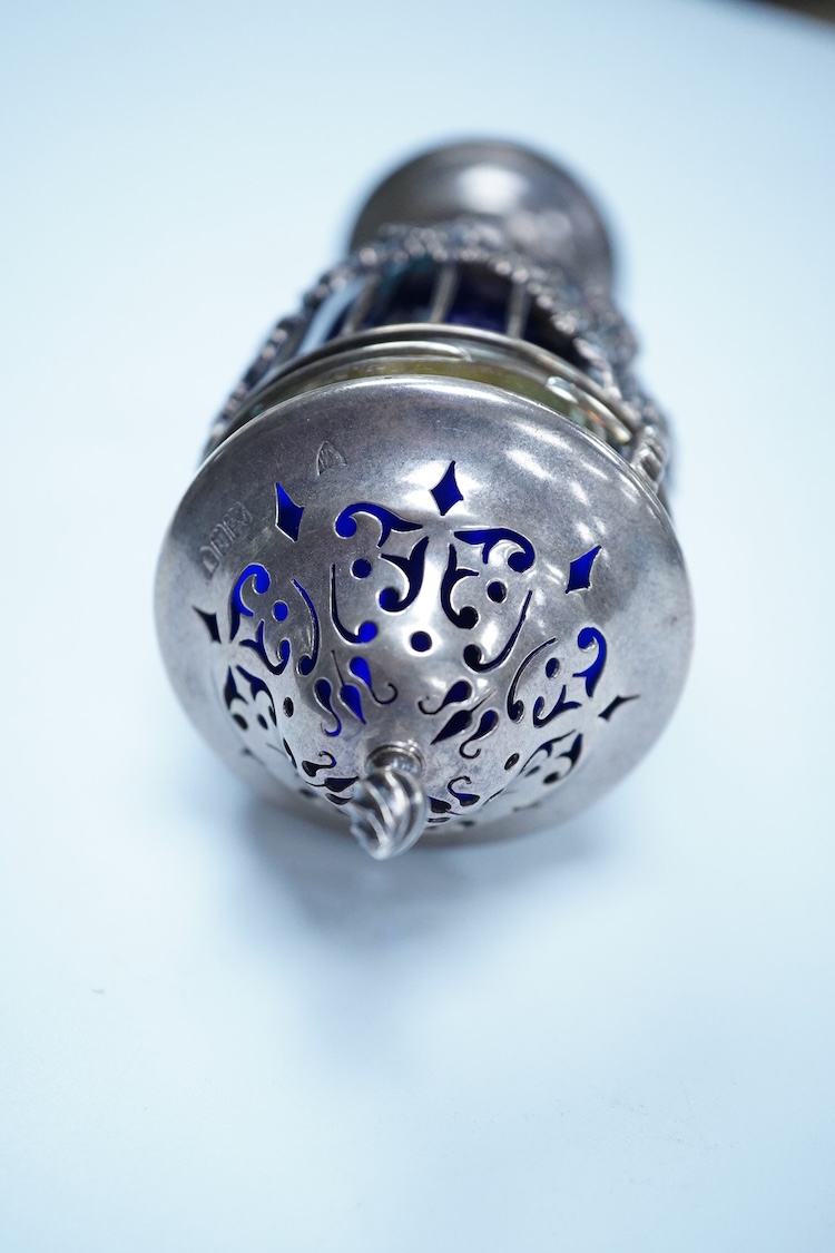 An Edwardian pierced silver sugar caster, with blue glass liner, Haseler Brothers, London, 1903, height 14.3cm.